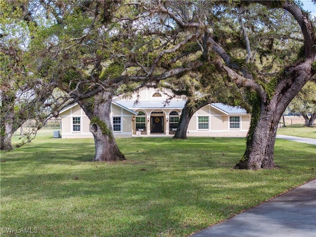 1132 Riverbend Dr, Labelle, FL 33935 - view of front facade with a front yard and stucco siding