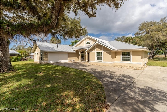 1132 Riverbend Dr, Labelle, FL 33935 - ranch-style home featuring stucco siding, an attached garage, a front yard, metal roof, and driveway