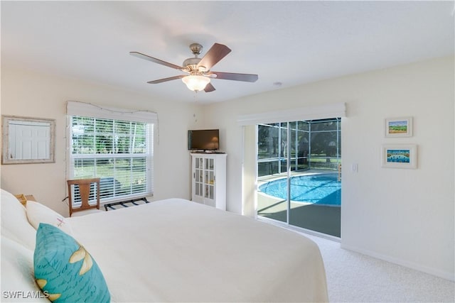 1132 Riverbend Dr, Labelle, FL 33935 - bedroom featuring carpet floors, a ceiling fan, a sunroom, access to outside, and baseboards