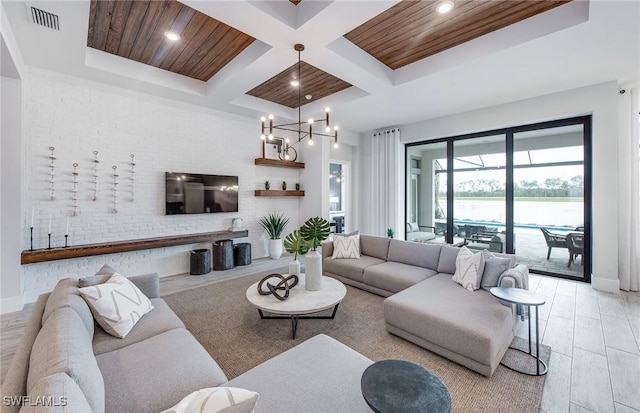 living room with beam ceiling, visible vents, light wood-style floors, wood ceiling, and coffered ceiling