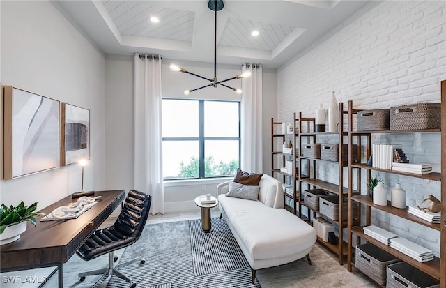 home office featuring a notable chandelier, recessed lighting, brick wall, wood finished floors, and baseboards