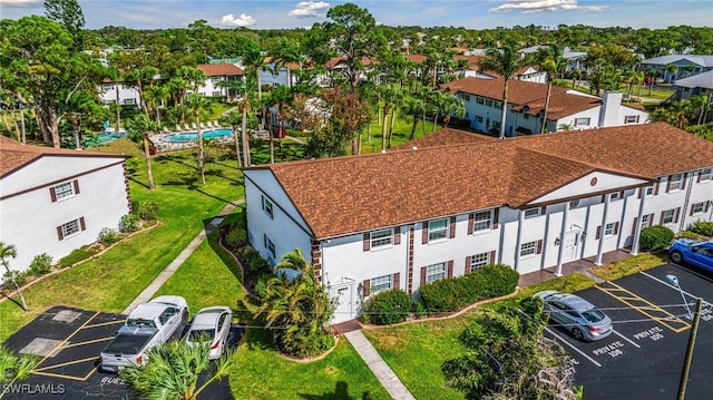 birds eye view of property with a residential view