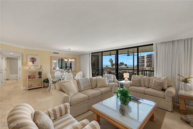 living area featuring visible vents, a notable chandelier, and ornamental molding