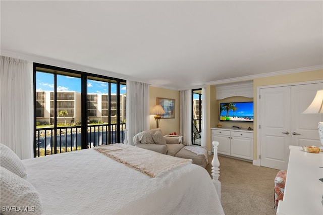 bedroom with light colored carpet, ornamental molding, and access to outside