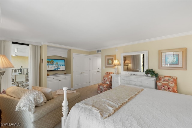 carpeted bedroom with visible vents and ornamental molding