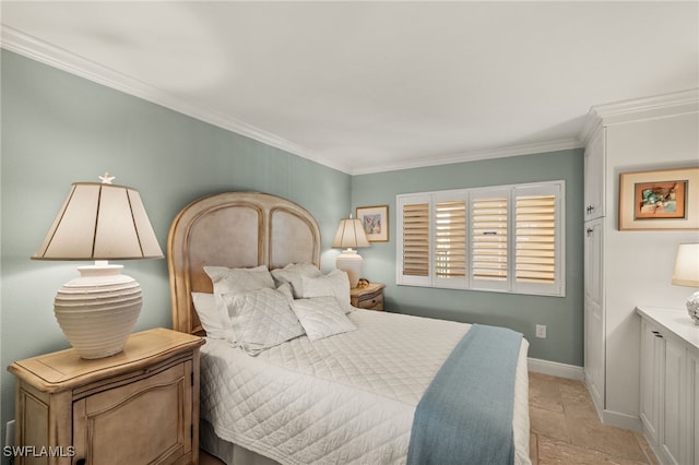 bedroom featuring stone finish floor, baseboards, and ornamental molding