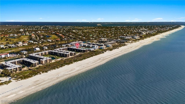 bird's eye view with a water view and a view of the beach