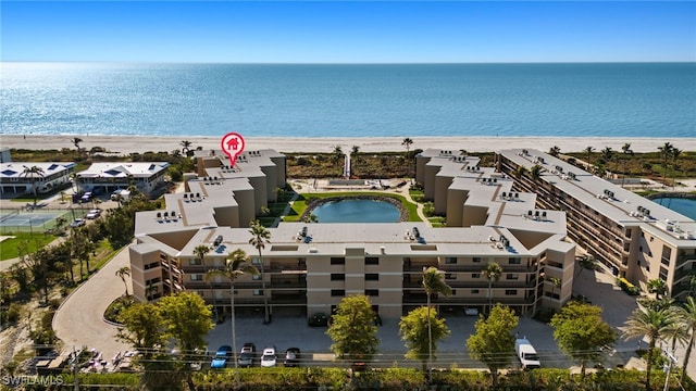 drone / aerial view featuring a view of the beach and a water view