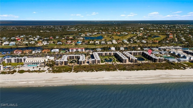 drone / aerial view featuring a view of the beach and a water view