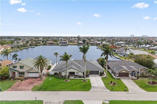 aerial view featuring a residential view and a water view