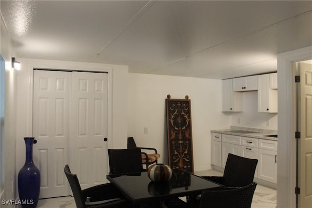 dining space with marble finish floor