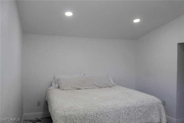 bedroom with recessed lighting and baseboards