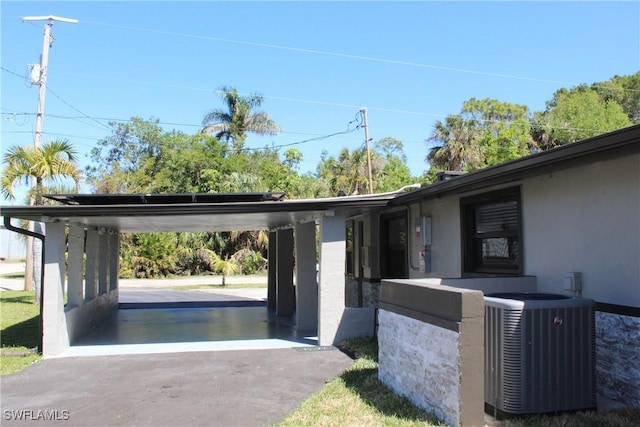 exterior space featuring a carport and driveway