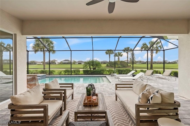 pool featuring a ceiling fan, a lanai, outdoor lounge area, and a patio