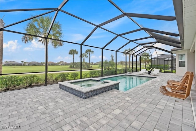 view of swimming pool featuring a pool with connected hot tub, glass enclosure, and a patio