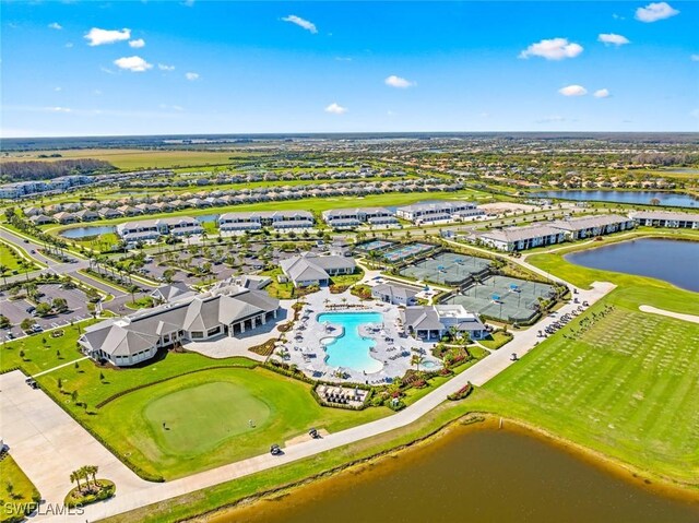 birds eye view of property with a water view