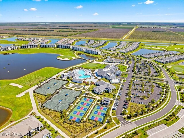 birds eye view of property with a water view