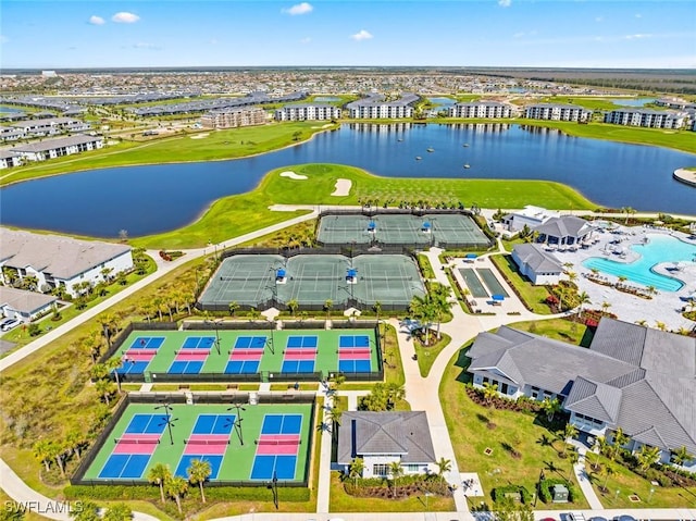 drone / aerial view featuring a water view and golf course view