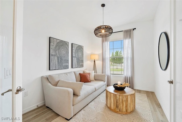 sitting room with light wood finished floors and baseboards