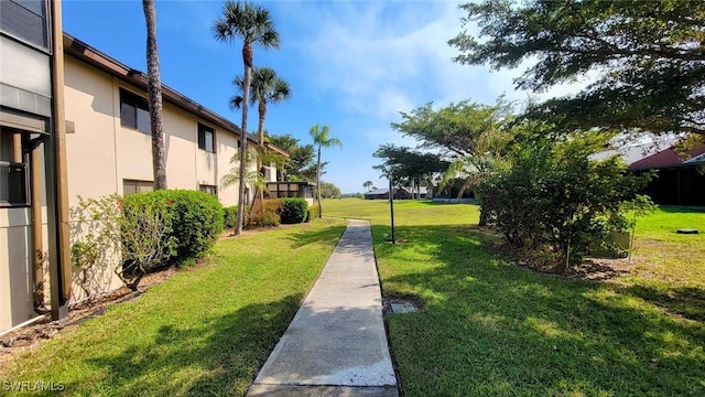 view of home's community featuring a yard