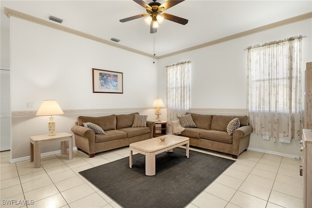 living room featuring light tile patterned floors, a ceiling fan, visible vents, and crown molding