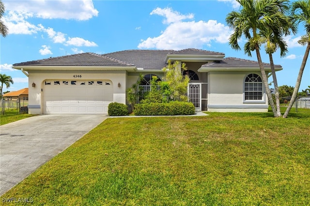 view of front of house with a garage, driveway, a front lawn, and stucco siding