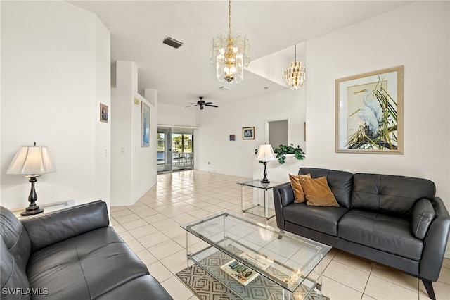 living room featuring ceiling fan with notable chandelier, light tile patterned flooring, and visible vents