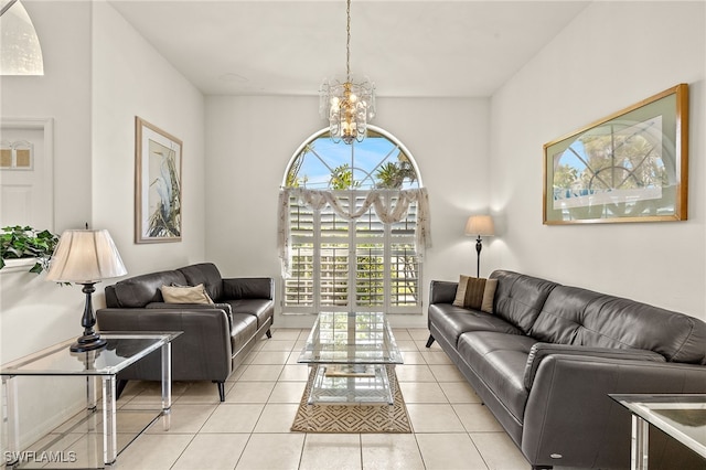 living room with an inviting chandelier and light tile patterned floors