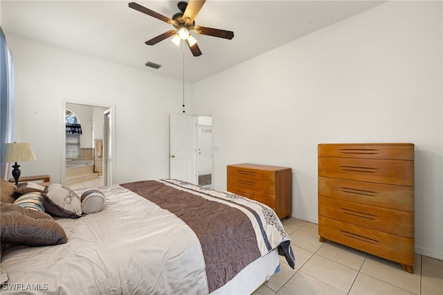 bedroom with a ceiling fan, visible vents, connected bathroom, and light tile patterned floors