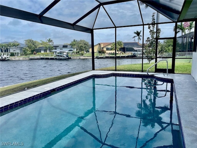 outdoor pool featuring a water view, a patio area, a lanai, and a residential view