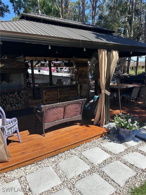 exterior space with a gazebo and a wooden deck