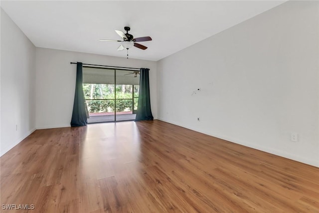 unfurnished room featuring ceiling fan and wood finished floors