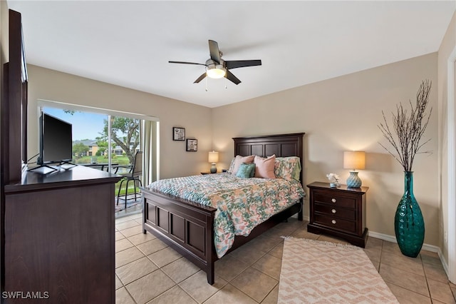 bedroom with access to exterior, light tile patterned flooring, a ceiling fan, and baseboards