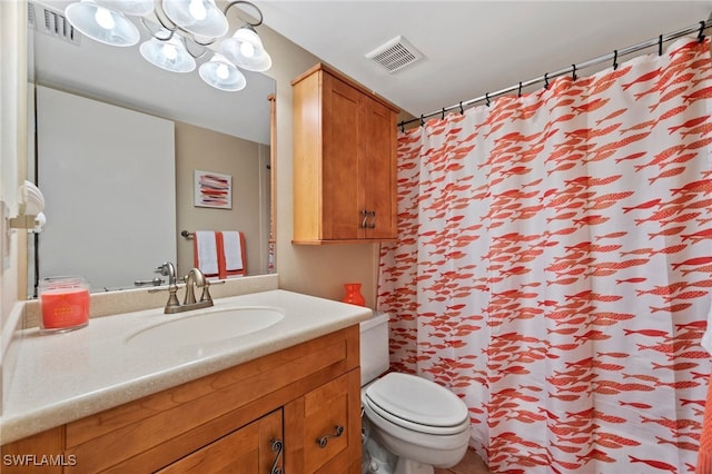 bathroom featuring toilet, a shower with shower curtain, vanity, and visible vents