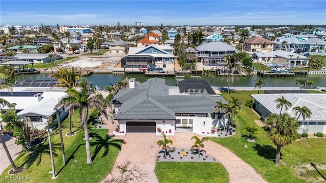 bird's eye view with a residential view and a water view