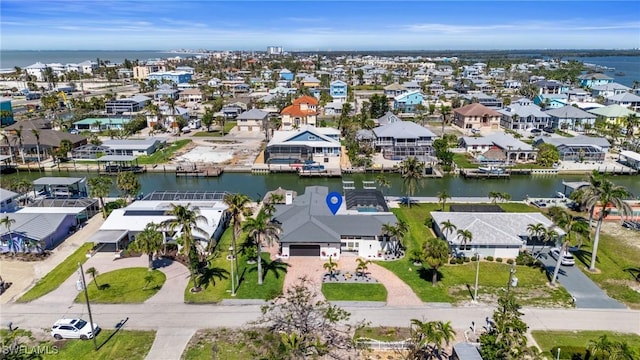 aerial view with a residential view and a water view