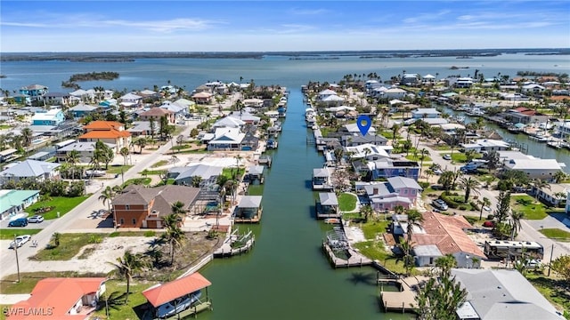 bird's eye view featuring a residential view and a water view