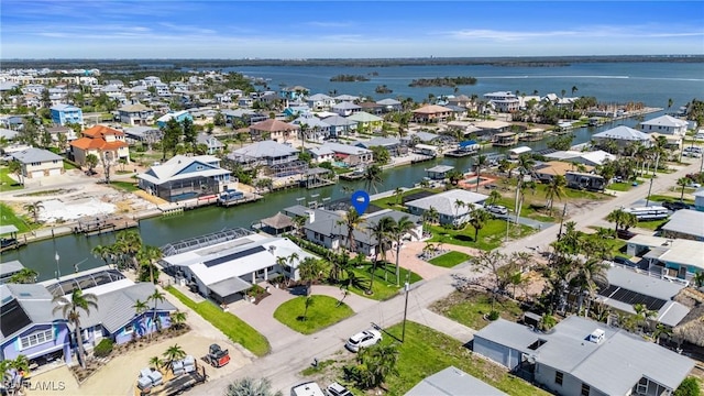 bird's eye view with a water view and a residential view