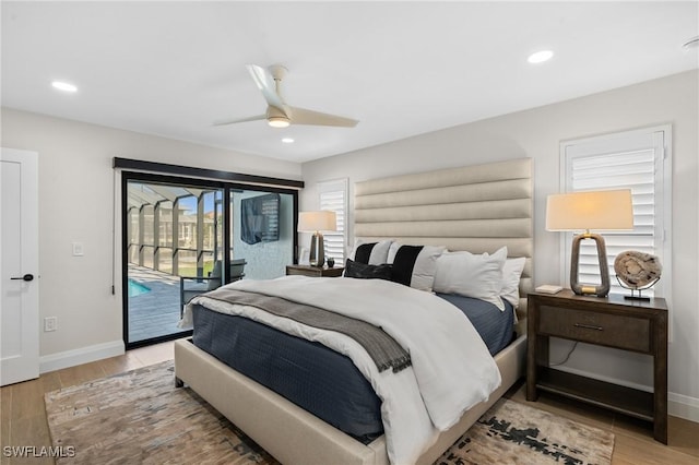 bedroom with access to outside, recessed lighting, light wood-style flooring, and baseboards