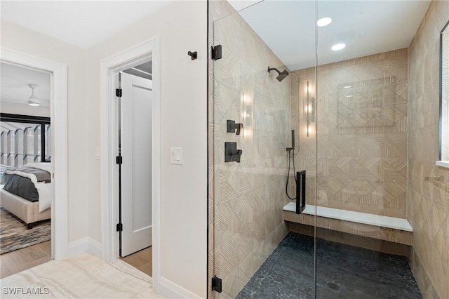 bathroom with ensuite bath, baseboards, and walk in shower