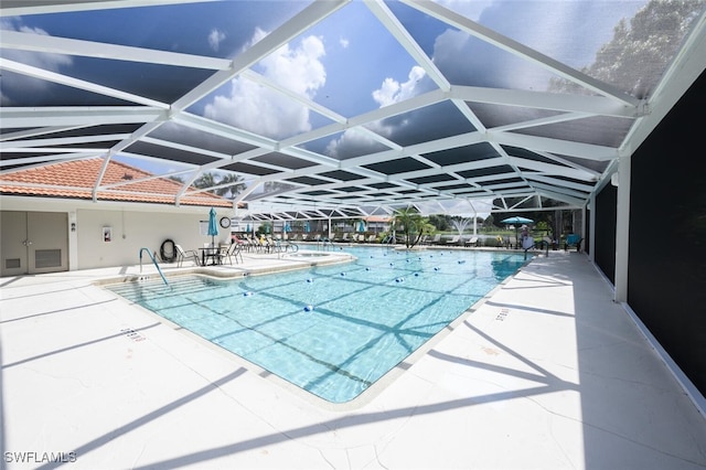 community pool with a lanai and a patio