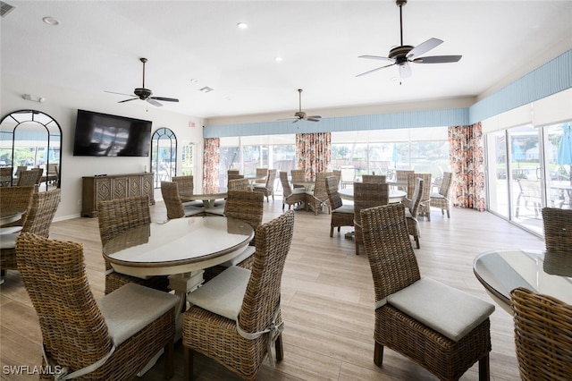 dining space featuring visible vents, plenty of natural light, and light wood finished floors