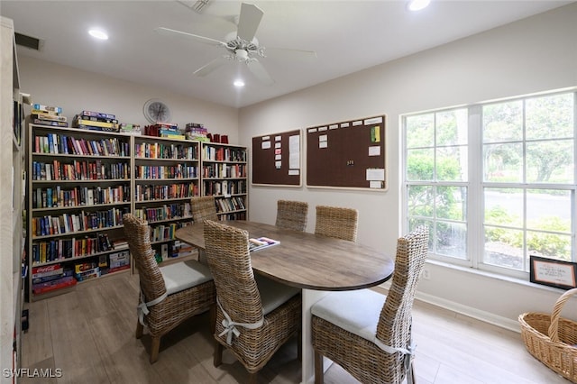 dining room with ceiling fan, baseboards, wood finished floors, and recessed lighting