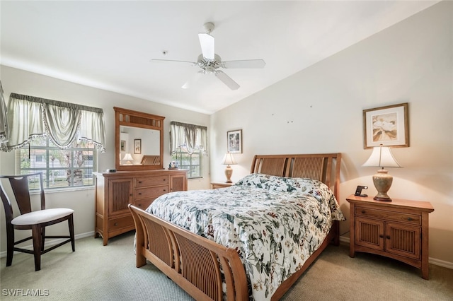 bedroom with light carpet, ceiling fan, and baseboards