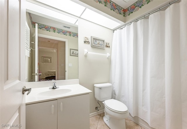 full bath featuring toilet, vanity, visible vents, and tile patterned floors