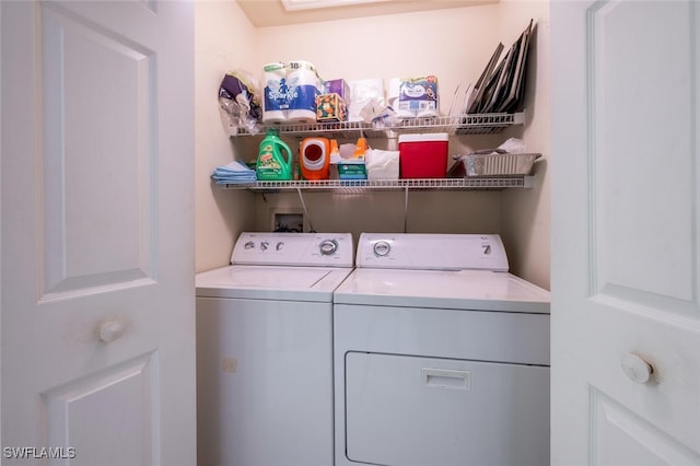 laundry area with laundry area and separate washer and dryer