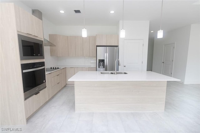 kitchen featuring modern cabinets, oven, and stainless steel fridge with ice dispenser