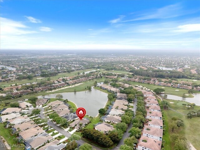 birds eye view of property with a residential view and a water view