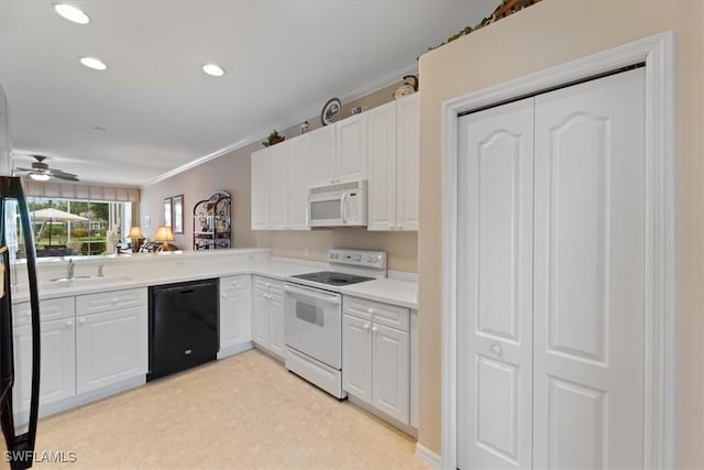 kitchen with white appliances, white cabinets, crown molding, and light countertops