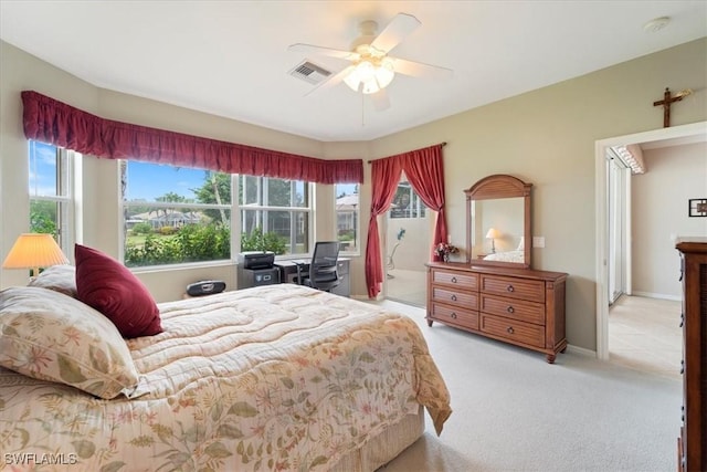 carpeted bedroom with multiple windows, a ceiling fan, visible vents, and baseboards